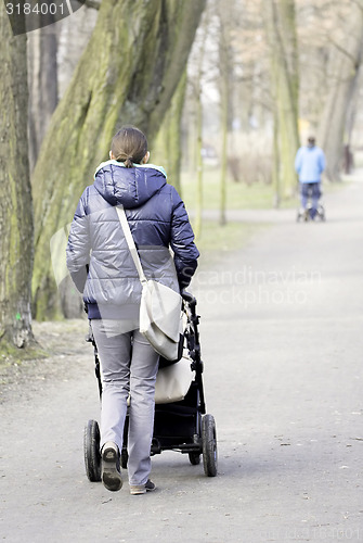 Image of Young mother with  pram 