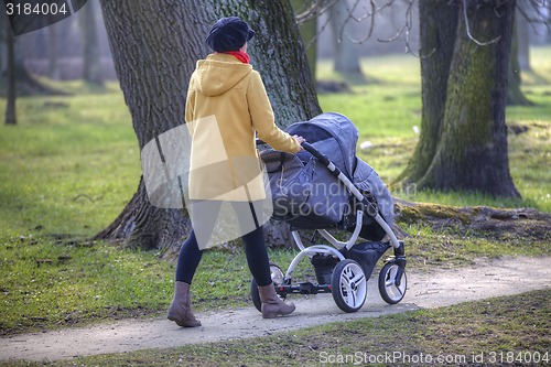 Image of Young mother with  pram 