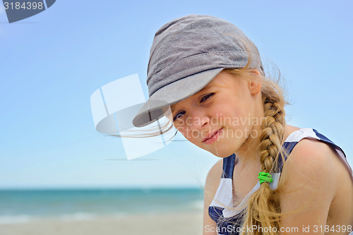Image of Portrait of beautiful small girl in denim hat