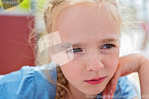 Image of Little girl looking away