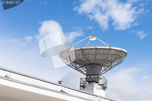 Image of Military radiolocator station with parabolic radar antenna dish