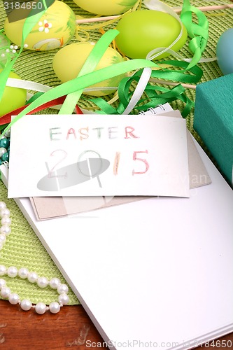 Image of Easter setting with gift box and spring decoration