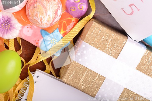 Image of Easter setting with gift box and spring decoration