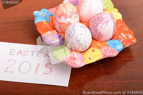 Image of Easter setting with gift box and spring decoration