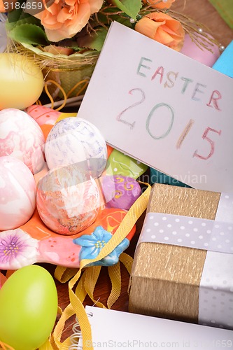Image of Easter setting with gift box and spring decoration