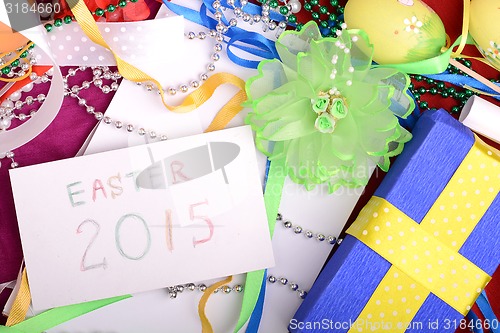 Image of Easter setting with gift box and spring decoration