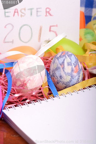 Image of Easter setting with gift box and spring decoration