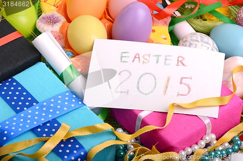 Image of Easter setting with gift box and spring decoration