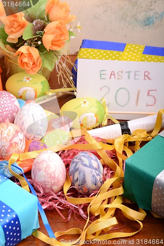 Image of Easter setting with gift box and spring decoration