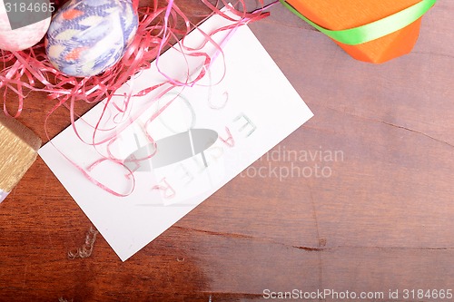 Image of Easter setting with gift box and spring decoration