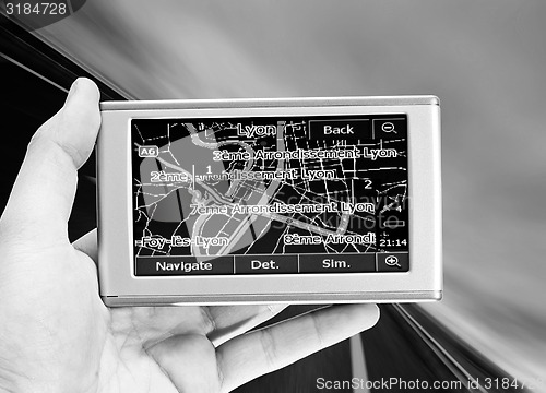 Image of GPS Vehicle navigation system in a man hand.