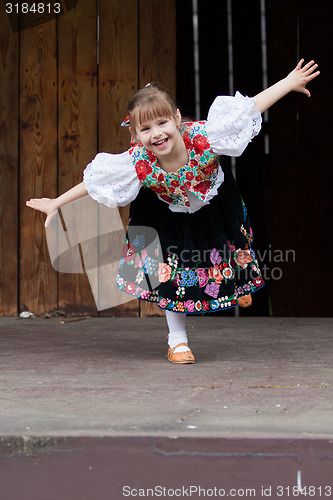 Image of Dancing little girl acting on the stage