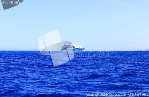 Image of White Ship floats on Water.