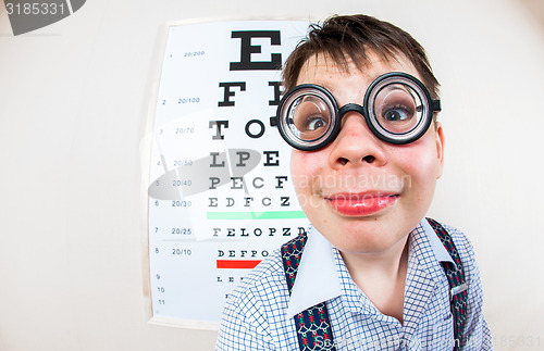 Image of Person wearing spectacles in an office at the doctor