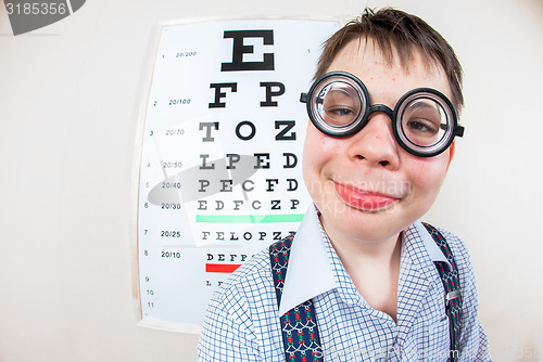 Image of Person wearing spectacles in an office at the doctor