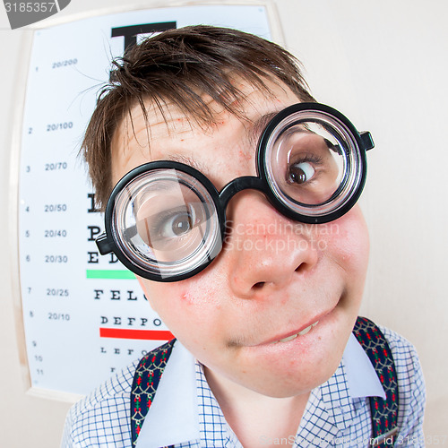 Image of Person wearing spectacles in an office at the doctor