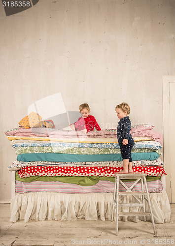 Image of Children on the bed - Princess and the Pea.