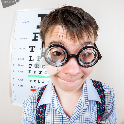 Image of Person wearing spectacles in an office at the doctor