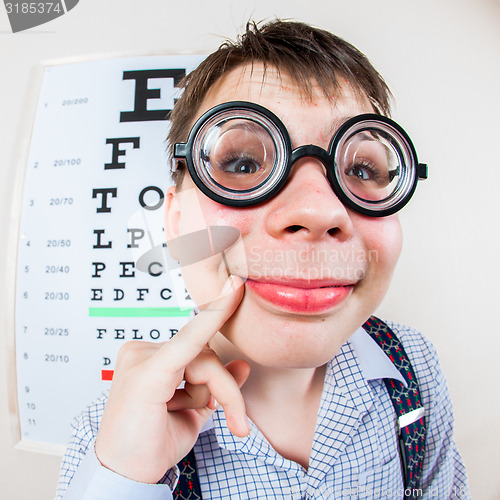 Image of Person wearing spectacles in an office at the doctor