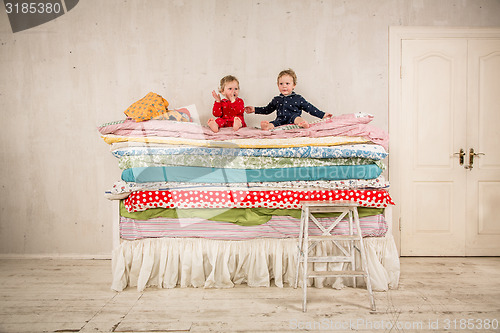 Image of Children on the bed - Princess and the Pea.