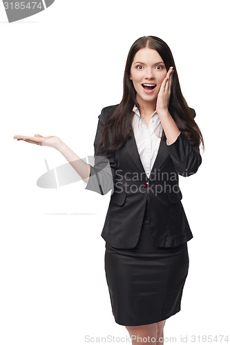 Image of Business woman showing open hand palm