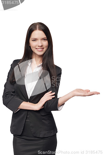 Image of Business woman showing open hand palm