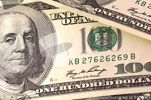 Image of Dollars closeup. Benjamin Franklin portrait on one hundred dollar bill