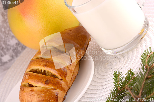 Image of sweet cake on white plate and fruits