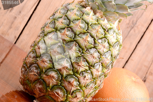 Image of fresh pineapple with orange