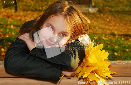 Image of Girl with autumn leaves