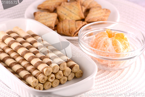Image of sweet cake on white plate with lemon