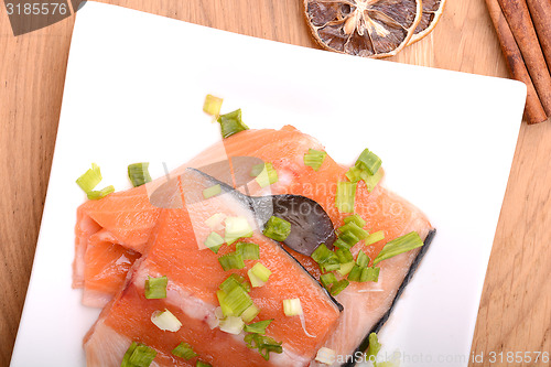 Image of Slice of red fish salmon with cinnamon