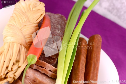 Image of salami, cheese and red pepper