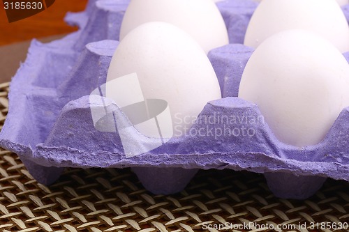 Image of close up of eggs in cardboard container