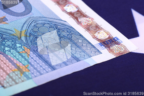 Image of european money on american flag