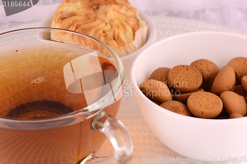 Image of cup of tea (coffee) and some cookies 