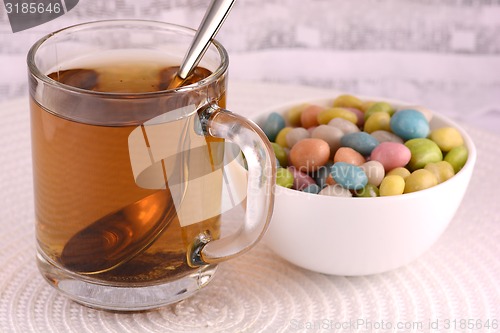 Image of A cup of tea (coffee) and candies