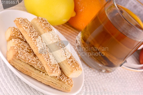 Image of sweet cake on white plate and fruits