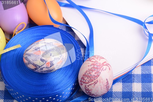 Image of Easter background with eggs, ribbons and spring decoration