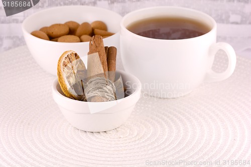 Image of cup of tea (coffee), some cookies and old fruits