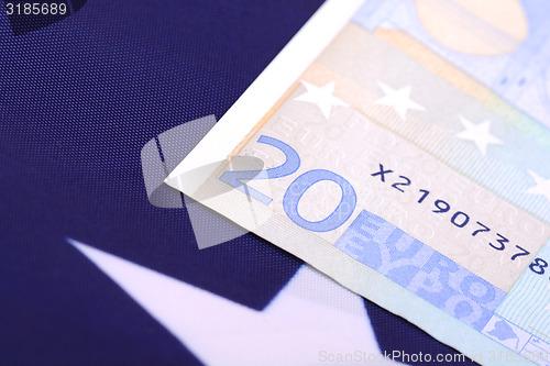 Image of european money on american flag