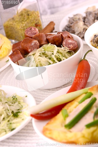 Image of tasty salad and chicken chop on white plate