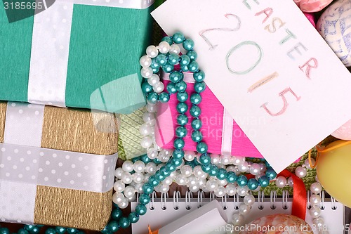 Image of Easter background with eggs, ribbons and spring decoration