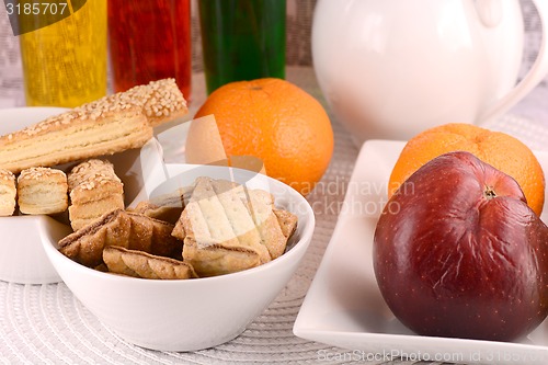 Image of sweet cake on white plate and fruits