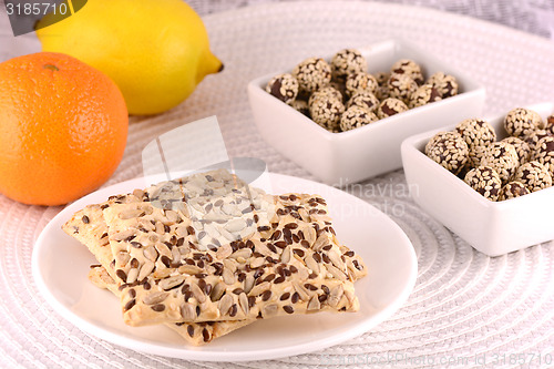 Image of sweet cake on white plate with fruits