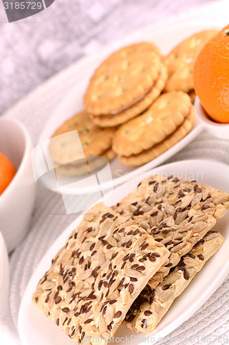 Image of sweet cake on white plate with fruits