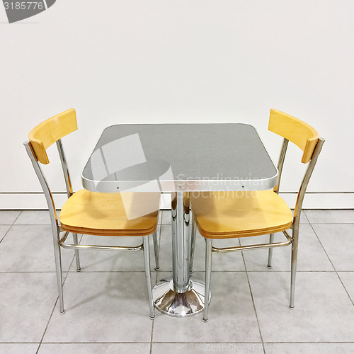 Image of Table with two chairs in a cafeteria