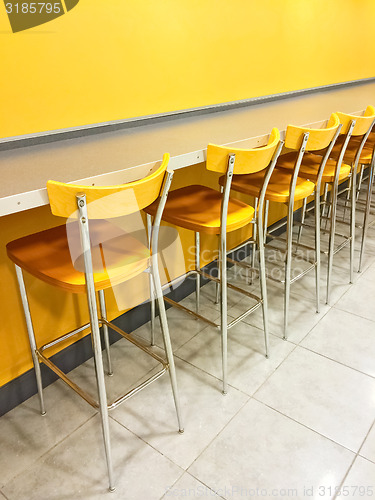 Image of Bright cafeteria with a raw of chairs