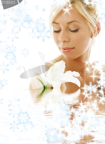 Image of lily blond in water with snowflakes