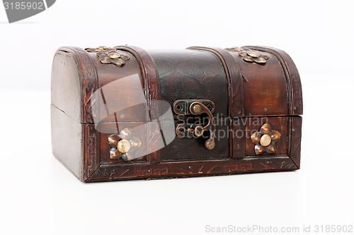 Image of chest on a light background. Wood with bronze